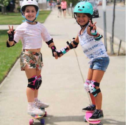 Two Kids Skating Together